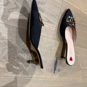 Gucci Black Mules.